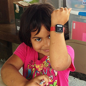 girl showing off wrist watch